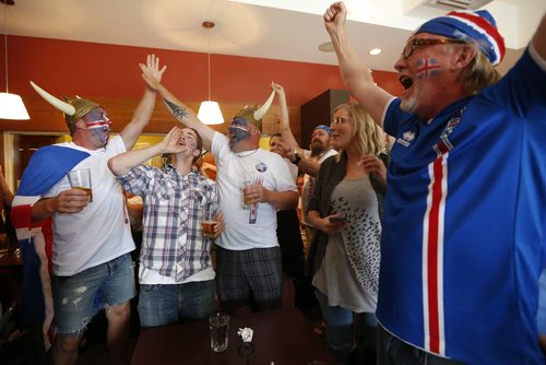JOHN WOODS / WINNIPEG FREE PRESS Iceland fans at the Lakeview Hotel in Gimli cheer as their team scores on  France in the Euro Cup Sunday, July 3, 2016.
