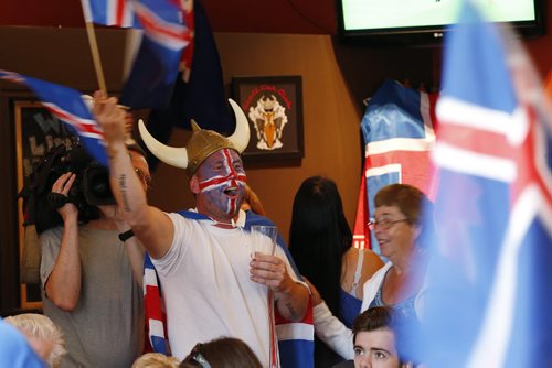 JOHN WOODS / WINNIPEG FREE PRESS Iceland fan Kristinn Traustason leads a cheer at the Lakeview Hotel in Gimli as they support their team as they battle France in the Euro Cup Sunday, July 3, 2016.