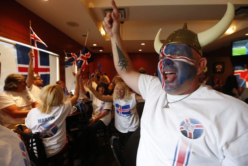JOHN WOODS / WINNIPEG FREE PRESS Haukur Gunnarsson and Iceland fans at the Lakeview Hotel in Gimli cheer as their team scores on  France in the Euro Cup Sunday, July 3, 2016.