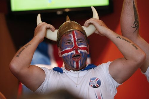 JOHN WOODS / WINNIPEG FREE PRESS Iceland fan Kristinn Traustason at the Lakeview Hotel in Gimli straightens his horns as his team battles France in the Euro Cup Sunday, July 3, 2016.