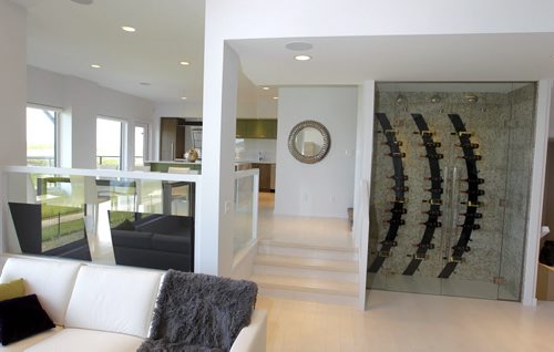 BORIS MINKEVICH / WINNIPEG FREE PRESS 45 East Plains Drive in Sage Creek. Artista Homes.  View from the living room with kitchen and wine rack. July 4, 2016