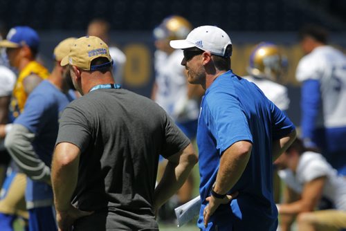 BORIS MINKEVICH / WINNIPEG FREE PRESS Winnipeg Blue Bombers practice at Investors Group Field in Winnipeg, MB.Right is Coach Paul LaPolice and right is Head Coach Mike O'Shea. July 4, 2016