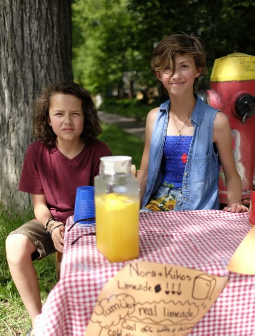 ZACHARY PRONG /  WINNIPEG FREE PRESS  Kiko, left, and Nora at their Lemonade Stand in Wolseley. The cousins are trying to raise money for Folk Fest. July 4, 2016.