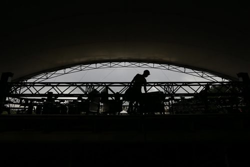 JOHN WOODS / WINNIPEG FREE PRESS Crew members prepare the rigging on the main stage in preparation for next weekend's Folk Fest Monday, July 4, 2016.