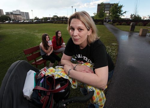 PHIL HOSSACK / WINNIPEG FREE PRESS - Charity McLellan poses outside the Grace Hospital where he son Ozzy, is a psychiatric patient. She and her son Jaxon 23mo (not in this photo) , and daughters Jenessa 10, (left) and Alycia spend as much time as possible at the hospital. Ozzy walked out of the unlocked ward recently. See story. 15 . July 4, 2016