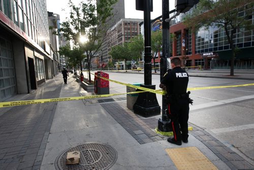 JOE BRYKSA / WINNIPEG FREE PRESS  Police are tight lipped about a investigation they are doing in downtown Winnipeg Tuesday morning-That investigation has seen police close Portage Ave in both direction between Hargrave St and Donald St, and close Donald between Ellice and Portage Ave- Police put up tape at Portage and Hargrave St near 7 am -July 05, 2016  -(Breaking News- See Redekop story)