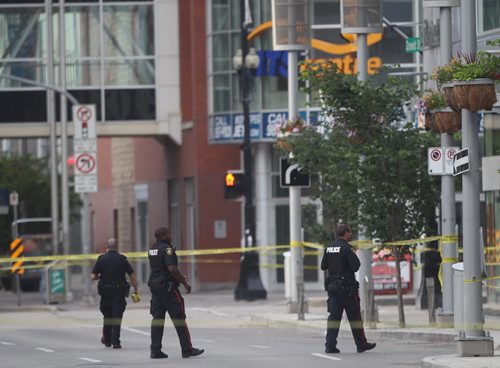 JOE BRYKSA / WINNIPEG FREE PRESS Police are tight lipped about a investigation they are doing in downtown Winnipeg Tuesday morning-That investigation has seen police close Portage Ave in both direction between Hargrave St and Donald St, and close Donald between Ellice and Portage Ave- Police at Donald and Portage -July 05, 2016  -(Breaking News- See Redekop story)