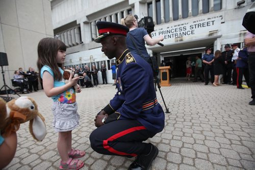 RUTH BONNEVILLE / WINNIPEG FREE PRESS  Five-year-old Taylor Pongracz chats with Winnipeg Police Chief Devon Clunis just before a ceremony was held in front of the PSB to bid Farewell to the old police head quarters on Princess Tuesday.  On July 5th, the doors to the Public Safety Building will officially close for good.    July 05, 2016
