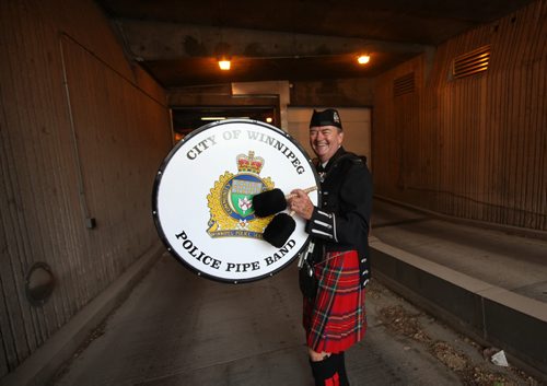 RUTH BONNEVILLE / WINNIPEG FREE PRESS  Winnipeg Police Pipe Band Bass Drummer Charles Bell, is all smiles as he makes his way down the ramp into the now old police head quarters after playing with the band for a ceremony to bid farewell to the PSB Tuesday. Bell has been in the band for 50 years starting his career as an officer just prior to Princess Street HQ opening in 1966.   On July 5th, the doors to the Public Safety Building will officially close for good.    July 05, 2016