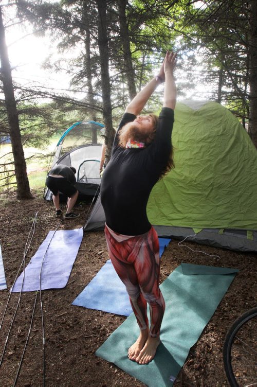 JOE BRYKSA / WINNIPEG FREE PRESS  Campers arrive at their campsites to kick off the 2016 Winnipeg Folk Fest at Birds Hill Park Wednesday morning-  Winnipeg yoga instructor Jitendradaf Lovelife does some moves before setting up his tent.Festival music starts tomorrow and will run until July 10-July 06, 2016  -(Standup Photo)