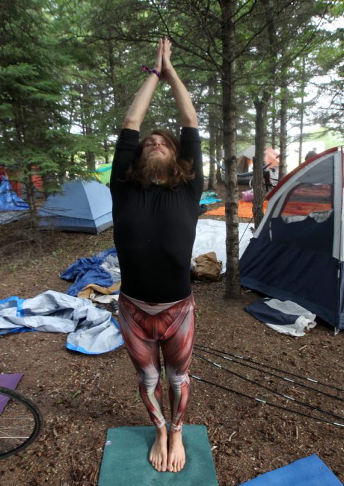 JOE BRYKSA / WINNIPEG FREE PRESS  Campers arrive at their campsites to kick off the 2016 Winnipeg Folk Fest at Birds Hill Park Wednesday morning-  Winnipeg yoga instructor Jitendradaf Lovelife does some moves before setting up his tent.Festival music starts tomorrow and will run until July 10-July 06, 2016  -(Standup Photo)