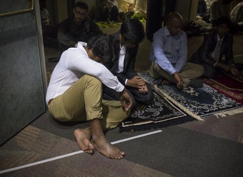 ZACHARY PRONG / WINNIPEG FREE PRESS  Men praying at the RBC Convention Centre where thousands of people gathered for Eid celebrations on July 6, 2016. Eid marks the end of the Muslim holy month of Ramadam.