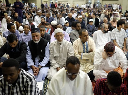 ZACHARY PRONG / WINNIPEG FREE PRESS  Men praying at the RBC Convention Centre where thousands of people gathered for Eid celebrations on July 6, 2016. Eid marks the end of the Muslim holy month of Ramadam.