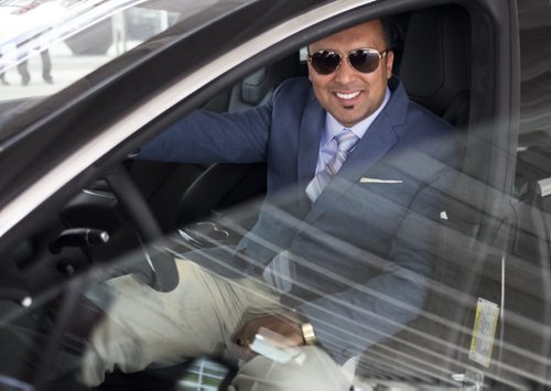 ZACHARY PRONG / WINNIPEG FREE PRESS  Ricky Brar, the president of Hollywood Limousine Service Inc., inside the company's newest addition to its fleet; a Tesla Model S. July 6, 2016.