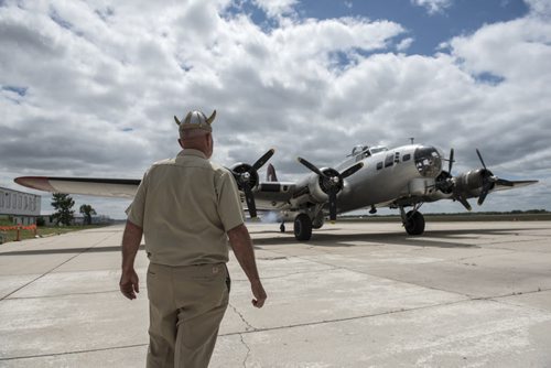 DAVID LIPNOWSKI / WINNIPEG FREE PRESS Crew Chief Craig Bartscht from Fort Wayne , Indiana checks over the engines of a Boeing B-17 Bomber (Flying Fortress) prior to takeoff from the Gimli Airport Wednesday July 6, 2016. The World War 2 era plane is one of only 13 aircraft of its type still flying.