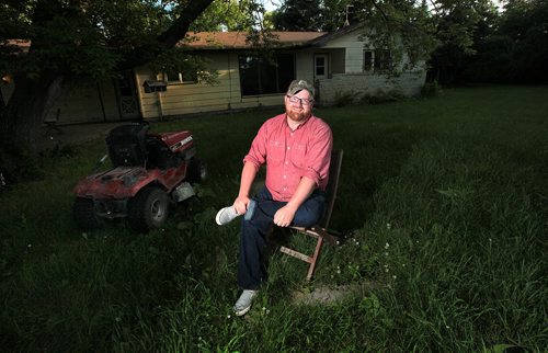 PHIL HOSSACK / WINNIPEG FREE PRESS - Chris Plett sits in his "sanctuary" an old farm yard he rents from his parents while working on the family farm near Steinbach. He'll be speaking at the Pride Parade and Rally in the community Saturday. See Melissa Martin story.  July 6, 2016