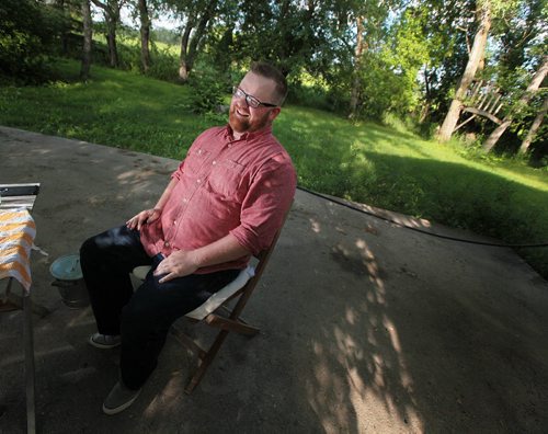 PHIL HOSSACK / WINNIPEG FREE PRESS - Chris Plett speaks with Melissa in his "sanctuary" an old farm yard he rents from his parents while working on the family farm near Steinbach. He'll be speaking at the Pride Parade and Rally in the community Saturday. See Melissa Martin story.  July 6, 2016