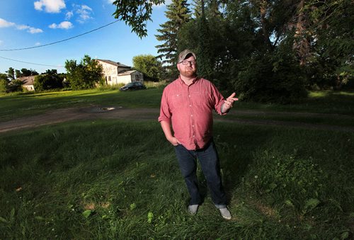 PHIL HOSSACK / WINNIPEG FREE PRESS - Chris Plett stands in his "sanctuary" an old farm yard he rents from his parents while working on the family farm near Steinbach. He'll be speaking at the Pride Parade and Rally in the community Saturday. See Melissa Martin story.  July 6, 2016