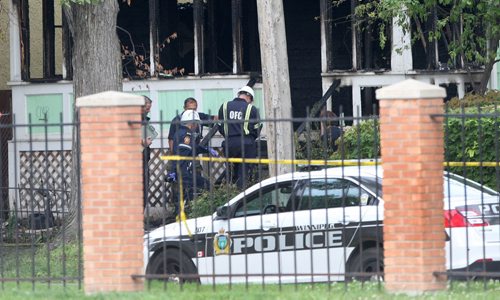 JOE BRYKSA / WINNIPEG FREE PRESS Police have a large perimeter set up around a double fatal house fire at 186 Austin St N as fire officials investigate-The fire started at aprx 130 am this morning.July 07, 2016  -(Breaking News)