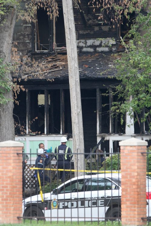 JOE BRYKSA / WINNIPEG FREE PRESS Police have a large perimeter set up around a double fatal house fire at 186 Austin St N as fire officials investigate-The fire started at aprx 130 am this morning- Office of the Fire Comissioners investigators on scene.July 07, 2016  -(Breaking News)