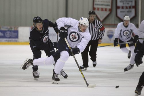 RUTH BONNEVILLE / WINNIPEG FREE PRESS  Matt Ustaski #74 races down the ice with Mason Appleton #82 on his heels in a scrimmage game during the Winnipeg Jets Development Camp at IcePlex Thursday morning.  General action shot of players on ice.   See Tim Campbell story.       July 06, 2016