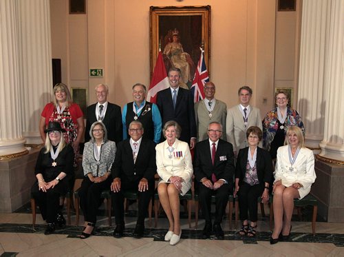 PHIL HOSSACK / WINNIPEG FREE PRESS - Premier Brian Pallister center back) poses with Lt Gov Janice Filmon and Gary Filmon along with eleven recipients of the order of Manitoba. Left to right they are : Back Row ; Bernadette Smith; Paul Albrechtsen; Reggie Leach; Dhali Dhaliwal; Gary Kobinger; Susan Thompson; Front row ; Wanda Koop; Betsy Kennedy; Wanbdi Wakita; Marileen Bartlett; Maria De Nardi.. See story. July 7, 2016