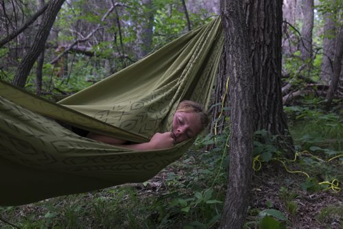 ZACHARY PRONG / WINNIPEG FREE PRESS Jill Marten relaxes in her hammock at Folkfest on July 8, 2016.