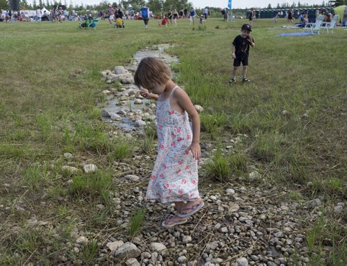 ZACHARY PRONG / WINNIPEG FREE PRESS  Children play in a small stream at Folkfest on July 8, 2016.