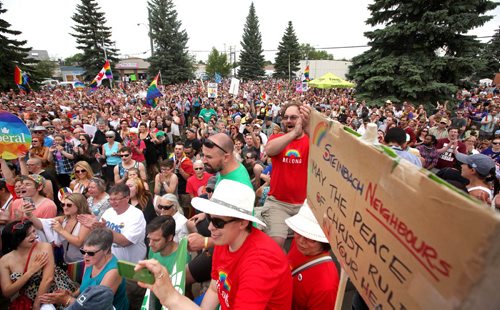 RUTH BONNEVILLE / WINNIPEG FREE PRESS  Thousands gather on the steps of City Hall to celebrate Steinbach's 1st ever Pride march Saturday.  July 09, 2016