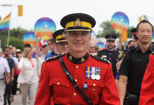 RUTH BONNEVILLE / WINNIPEG FREE PRESS  Members of the RCMP and local police personal walk with thousands of supporters of Steinbach's 1st ever Pride march to the steps of City Hall to celebrate  Saturday.  July 09, 2016