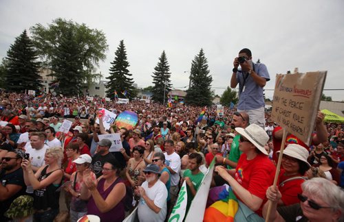 RUTH BONNEVILLE / WINNIPEG FREE PRESS  Thousands gather on the steps of City Hall to celebrate Steinbach's 1st ever Pride march Saturday.  July 09, 2016