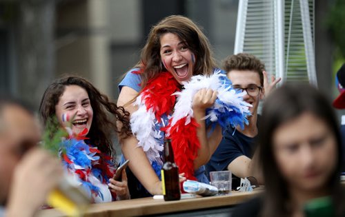 TREVOR HAGAN / WINNIPEG FREE PRESS Salomé Checura-Rojas, Alice Auvray, and Paul-Alexis Saint-Antonin, all from France, watching the Euro 2016 Final at Teo's on Corydon, Sunday, July 10, 2016.