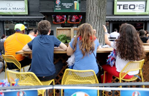 TREVOR HAGAN / WINNIPEG FREE PRESS Paul-Alexis Saint-Antonin, Alice Auvray and Salomé Checura-Rojas, all from France, watching the Euro 2016 Final at Teo's on Corydon as Portuguese star Cristiano Ronaldo is hurt, Sunday, July 10, 2016.