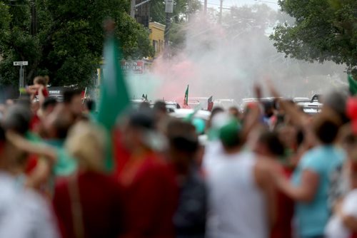 TREVOR HAGAN / WINNIPEG FREE PRESS Red and Green smoke fills the air as fans of the Portuguese soccer team celebrate on Sargent Avenue after their team defeated France in the Euro 2016 Final, Sunday, July 10, 2016.