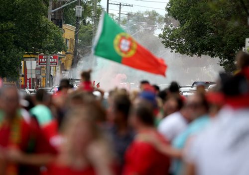 TREVOR HAGAN / WINNIPEG FREE PRESS Red and Green smoke fills the air as fans of the Portuguese soccer team celebrate on Sargent Avenue after their team defeated France in the Euro 2016 Final, Sunday, July 10, 2016.