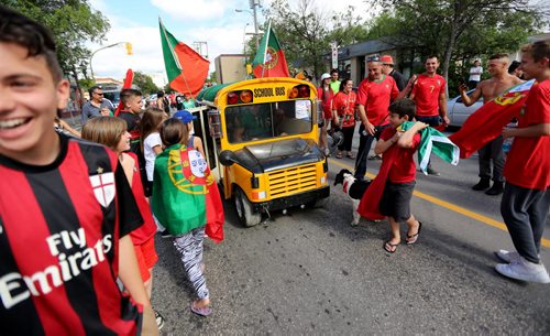 TREVOR HAGAN / WINNIPEG FREE PRESS Fans of the Portuguese soccer team celebrate on Sargent Avenue after their team defeated France in the Euro 2016 Final, Sunday, July 10, 2016.