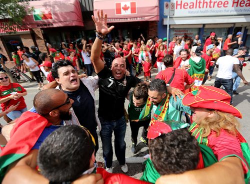 TREVOR HAGAN / WINNIPEG FREE PRESS Fans of the Portuguese soccer team celebrate on Sargent Avenue after their team defeated France in the Euro 2016 Final, Sunday, July 10, 2016.