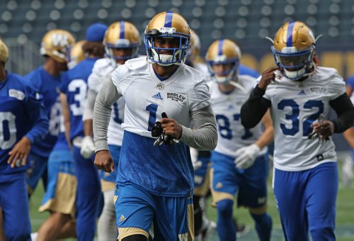 JOE BRYKSA / WINNIPEG FREE PRESS   Winnipeg Blue Bomber Jace Davis, centre, leads the team out of a chant at practice Monday at IGF -The Winnipeg Blue Bombers are in preparation for a home game this Thursday against the Edmonton Eskimos-July 11, 2016  -(See Paul Wiecek story)