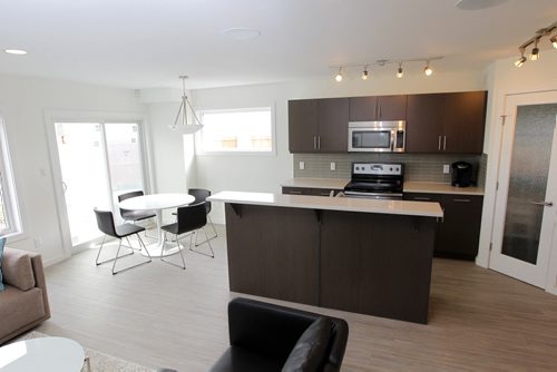 BORIS MINKEVICH / WINNIPEG FREE PRESS NEW HOMES - 255 Peguis Street in Transcona. Realtor Sabie Brar. New side by side houses.  Living room looking onto the kitchen. July 11, 2016