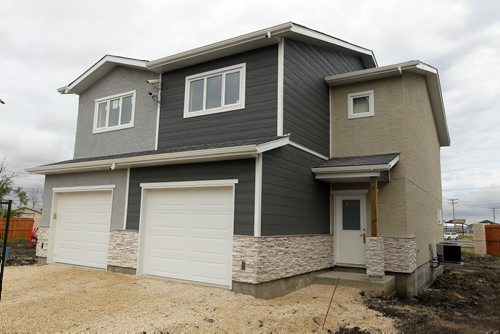 BORIS MINKEVICH / WINNIPEG FREE PRESS NEW HOMES - 255 Peguis Street in Transcona. Realtor Sabie Brar. New side by side houses.  Side by side. The one on the right is the house featured. July 11, 2016