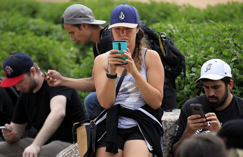 PHIL HOSSACK / WINNIPEG FREE PRESS - Alyssa Christie followed her phone to a Pokemon meet-up at the Oodena Circle. See Alex dePape's story. July 11, 2016