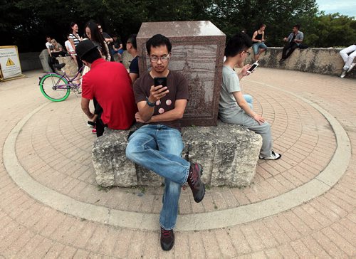 PHIL HOSSACK / WINNIPEG FREE PRESS - Mark Petrasanta followed his phone to a Pokemon meet-up at the Oodena Circle. See Alex de Pape's story. July 11, 2016