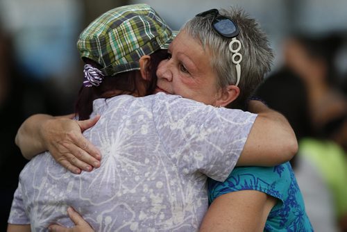 JOHN WOODS / WINNIPEG FREE PRESS Family and friends comfort eachother at a vigil for Thelma Krull at Civic Park Monday, July 11, 2016.