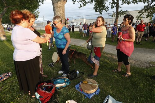 JOHN WOODS / WINNIPEG FREE PRESS Family and friends take part in a tobacco ceremony at a vigil for Thelma Krull at Civic Park Monday, July 11, 2016.