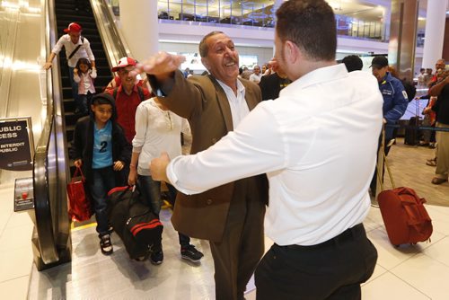 JOHN WOODS / WINNIPEG FREE PRESS Khudher Naso and his family are greeted by family and supporters at the Winnipeg airport Monday, July 11, 2016. The Yazidis families arrived from Turkey.