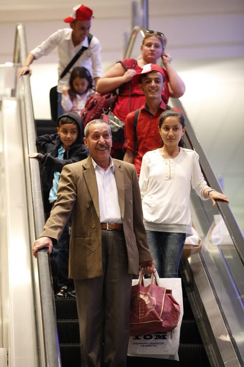 JOHN WOODS / WINNIPEG FREE PRESS Khudher Naso and his family arrive at the Winnipeg airport Monday, July 11, 2016. The Yazidis families arrived from Turkey.