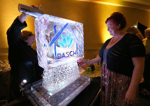 JASON HALSTEAD / WINNIPEG FREE PRESS  Lyn Belanger, DASCH program co-ordinator, checks out the ice martini fountain at the DASCH Possibilities Gala at the RBC Convention Centre Winnipeg on June 23, 2016. (See Social Page)
