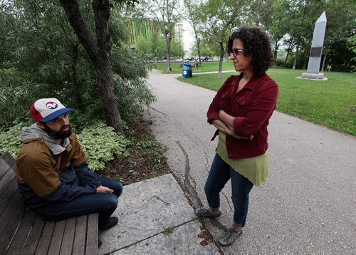 PHIL HOSSACK / WINNIPEG FREE PRESS -  Leah Decter right, and Jeff Friesen talk to Melissa in Stephen Juba Park with the Aquaduct Monument behind them tuesday. See Melissa Martin story re: 13 Fires.  July 12, 2016