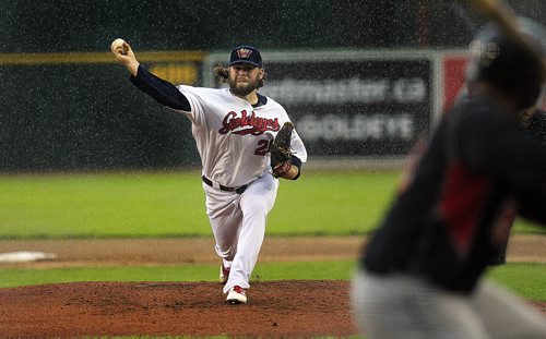 PHIL HOSSACK / WINNIPEG FREE PRESS - Winnipeg Goldeye pitcher Mikey O'Brien peers through the rain early in the game as he delivers against the Souix City Explorers #9 Matt Koch Tuesday night at CanWest Global Park. See Tim Campbell's story.  July 12, 2016