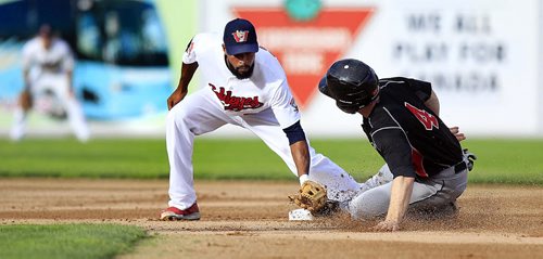 PHIL HOSSACK / WINNIPEG FREE PRESS - Winnipeg Goldeye #9 Casio Grider reaches down to tag Souix City's #4 Tim Colwell at 2nd base Tuesday night at CanWest Global Park. Colwell slipped his foot around Grider's glove to tag safe on the play. See Tim Campbell's story.  July 12, 2016